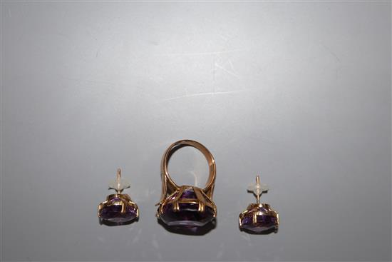 A modern 585 yellow metal and amethyst set dress ring, size M and a pair of similar 18k earrings.